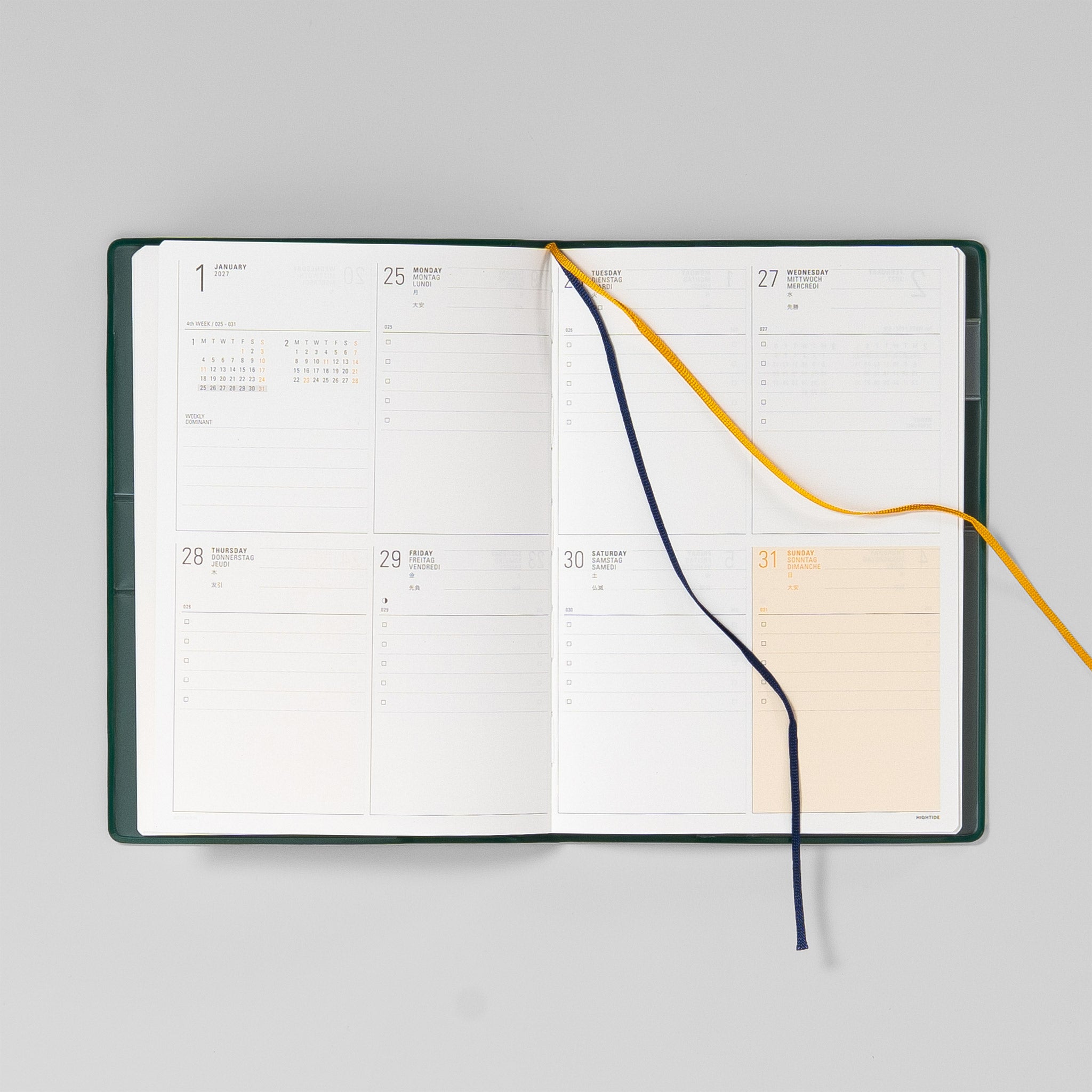 Zwei Lesebändchen in Navy und Gelb am Iris B6 Wochenkalender
